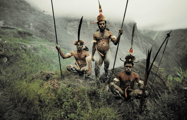 A photograph of three Dani Tribe members (taken by Jimmy Nelson)