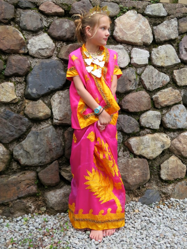 My Tari Kipas Princess! I love the way she is holding her hands in this picture.  The funny thing about it is that she's naturally (and successfully) hiding a piece of pizza crust between her hands.