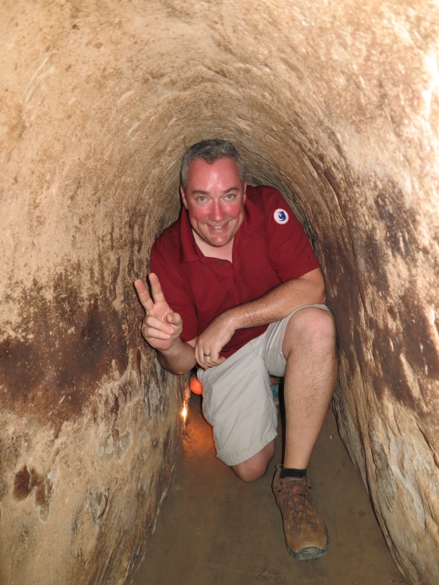 Chris crawling through the Cu Chi Tunnels.  The Cu Chi tunnel system was an extensive and impressive network of underground tunnel systems that the Viet Cong hid and operated in.  The tunnel system, made of three levels and 250km of space, was a community that included living quarters and caches for food, tools, and weapons. 