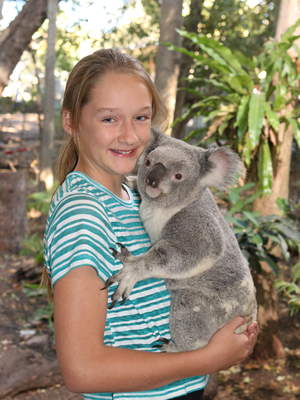 Ally cuddling a koala at Lone Pine Koala Sanctuary in Brisbane.