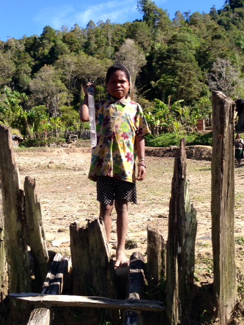 Girl holding her machete.
