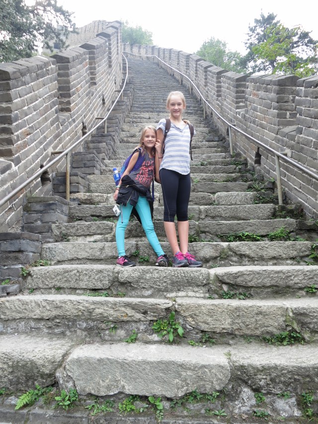 Ally and Kylee standing on the Great Wall of China.  