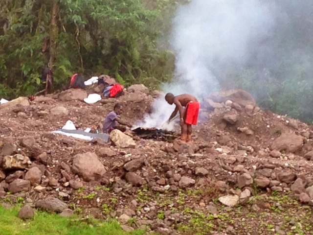 The men took a short break to cook ayam (chicken) over a fire.  After a short lunch break, they went back to work.  The Papuans are hard, dedicated workers.