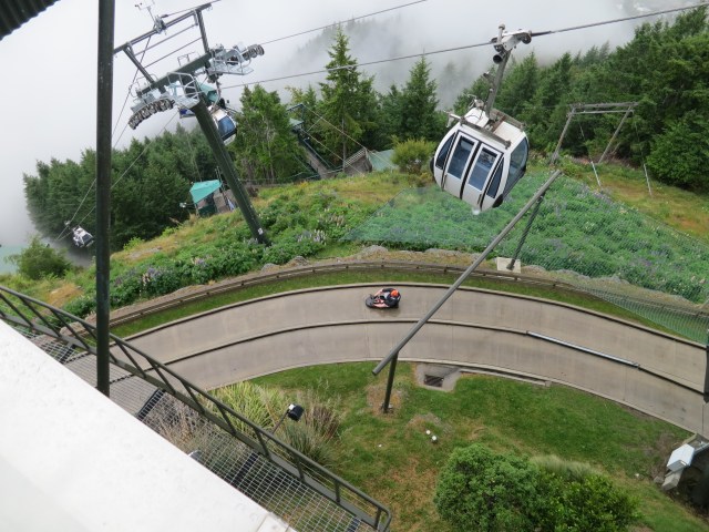 This is a picture of Chris going down the alpine slide. 