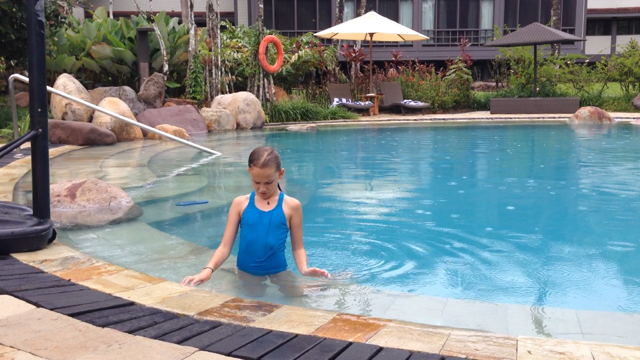 Kylee trying to locate a frog that jumped from her hand to her chest.