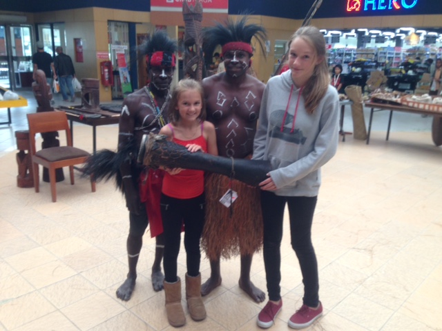Ally and Kylee with two of the Papuan men who were involved in the drum skinning presentation. The man of the left is Herman, one of Dr. Muller's biggest supporters. The girls are holding the drum, which we were able to purchase, that was used in the presentation 