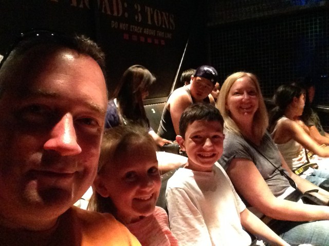 Chris, Kylee, Alex, and Chris's sister, Wendy, waiting to begin their Tower of Terror ride.